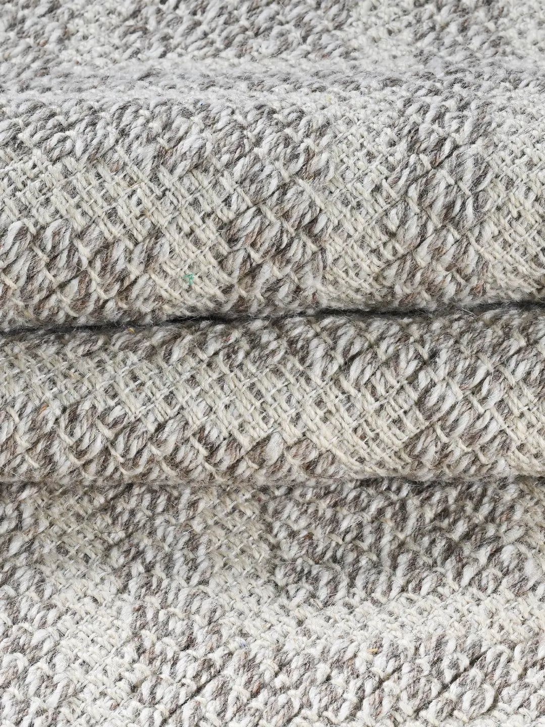 minimalist hand woven rug close up