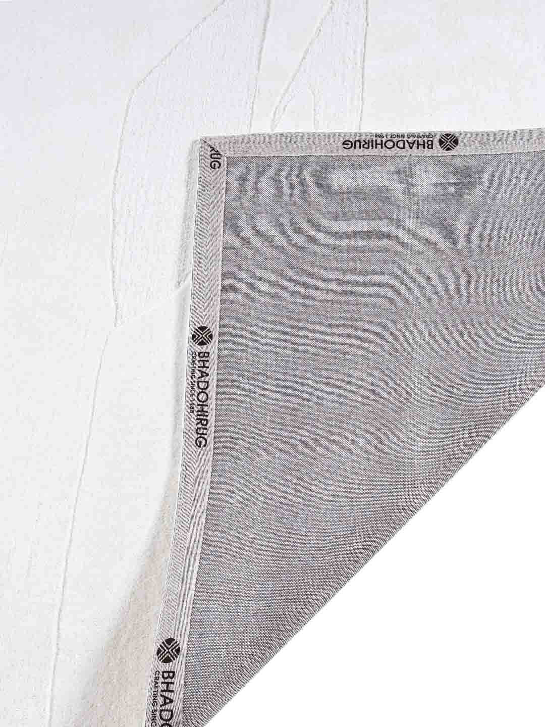 white tufted rug by bhadohirug