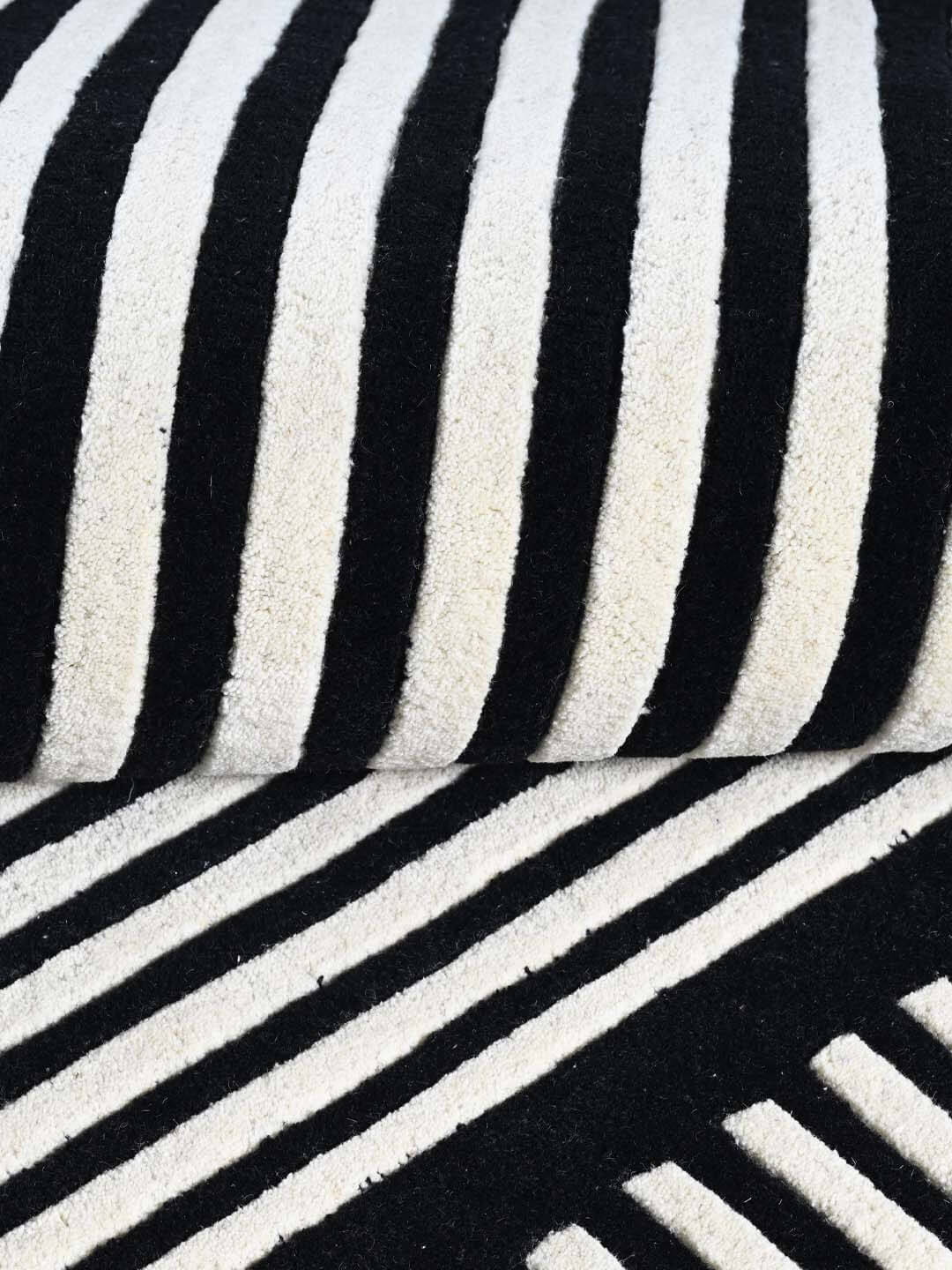 Close-up of black and white striped wool rug