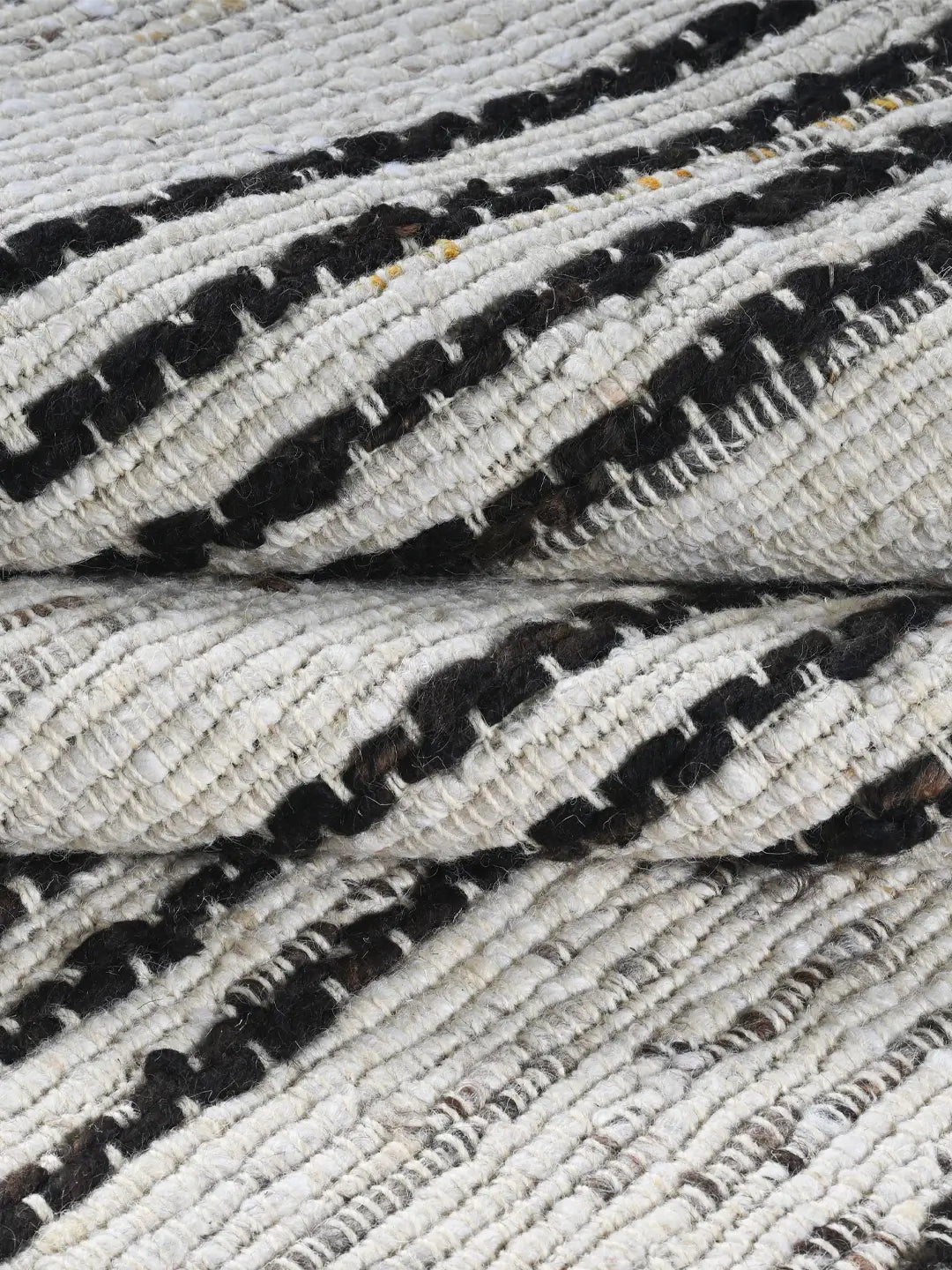 close look of strip pattern hand woven rug