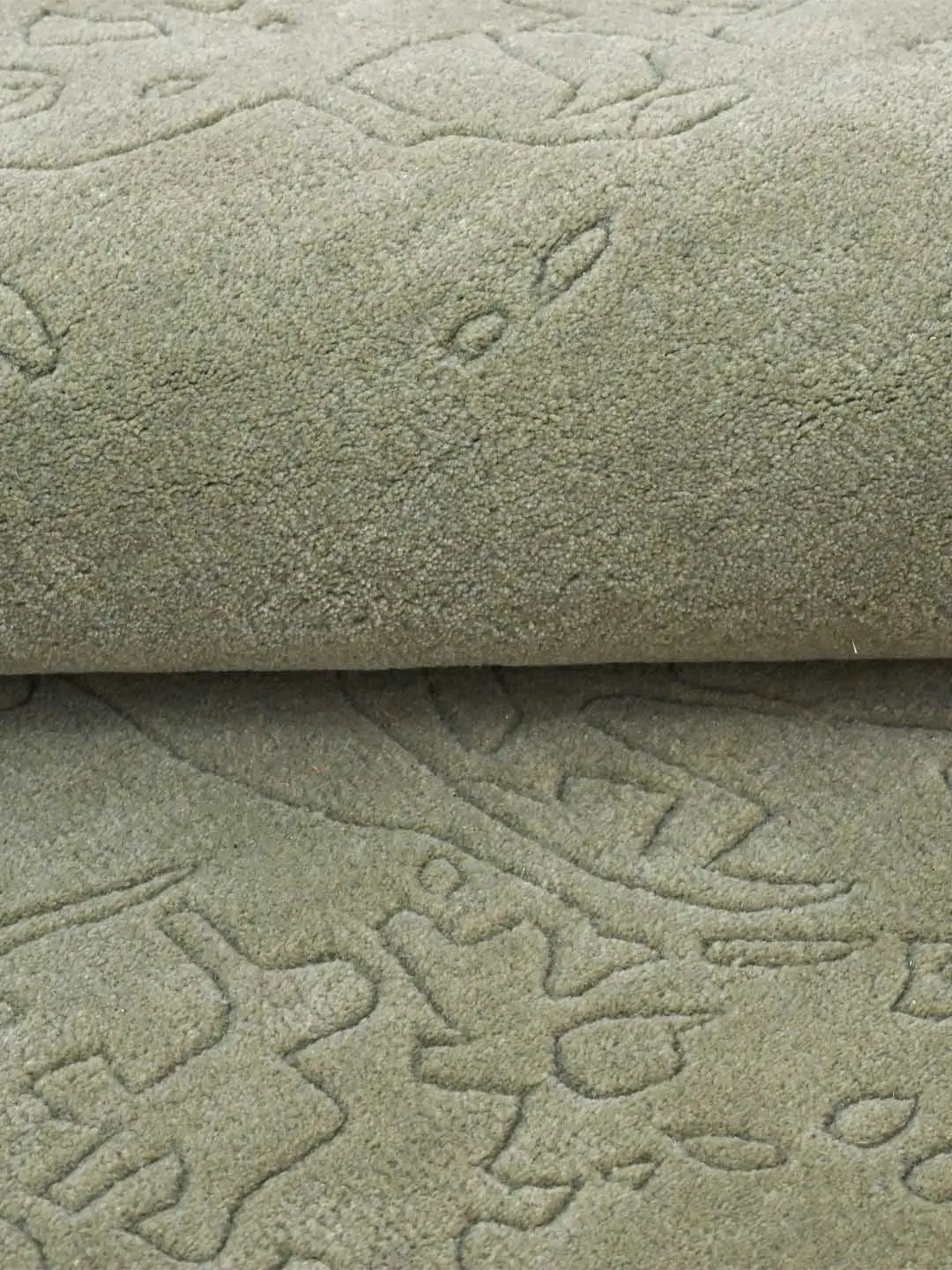 green wool rug close up