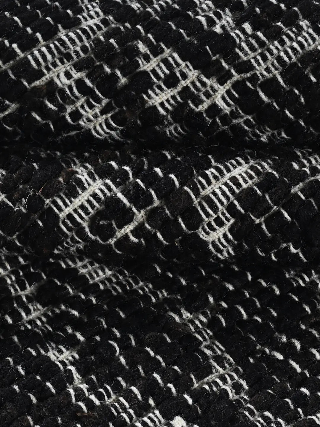 elora black woven rug by bhadohirug