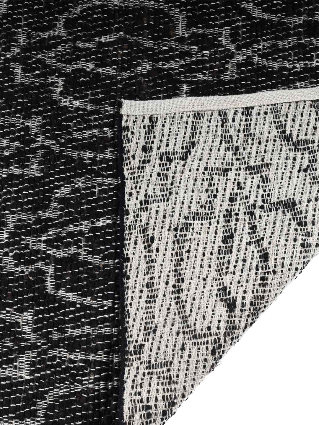 Close-up of a textured black and white patterned carpet