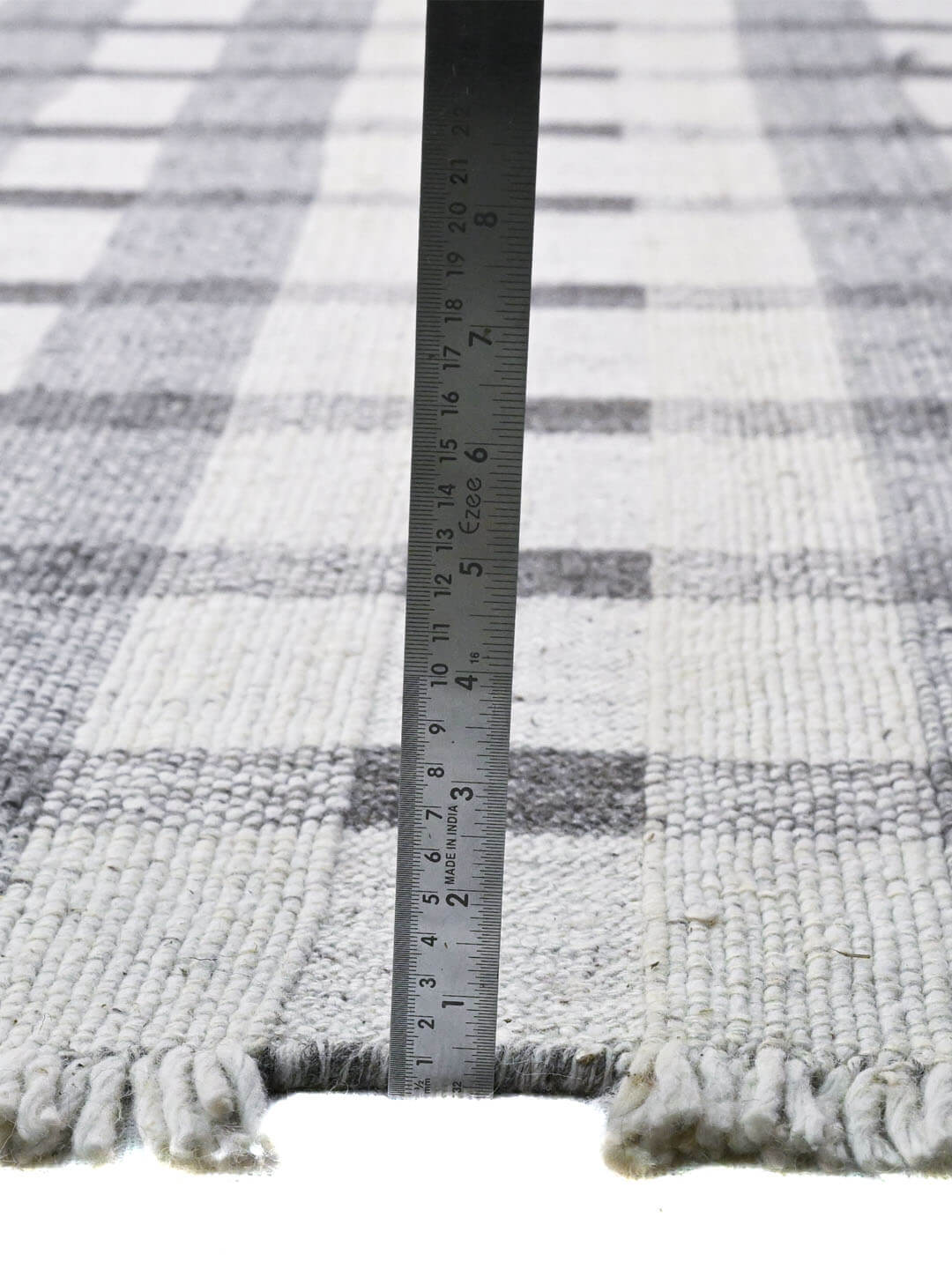 Gray and white plaid pattern rug
