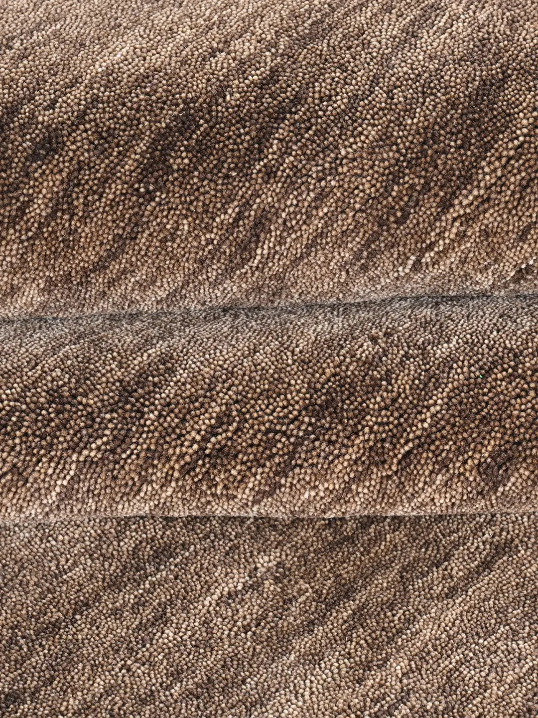 close up of a handloom brown rug