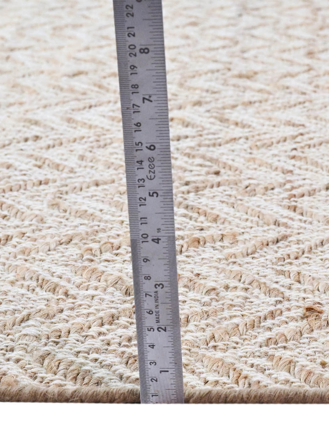 Beige woven rug